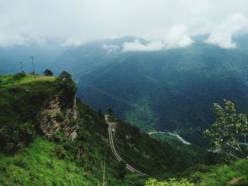 Scenic view of landscape and mountains against sky