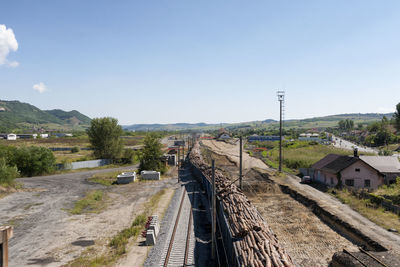 High angle view of road by buildings against sky