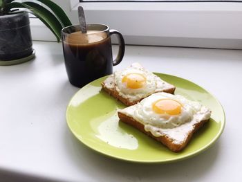 Close-up of breakfast in plate on table