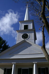 Low angle view of cross against sky