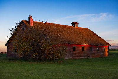 House on field against sky