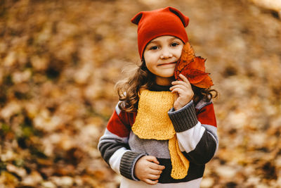 Portrait of a smiling girl during autumn