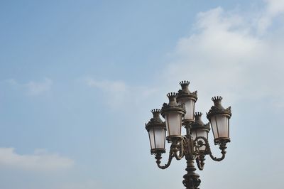 Low angle view of street light against sky