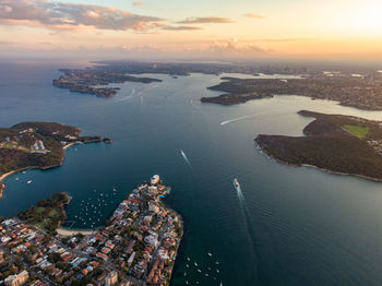 Drone evening view of sydney harbour. manly in the foreground, south head and sydney cbd in the back