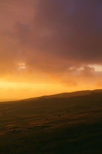 Scenic view of landscape at sunset