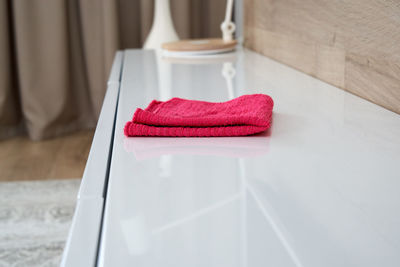 Close-up of red paper on table at home