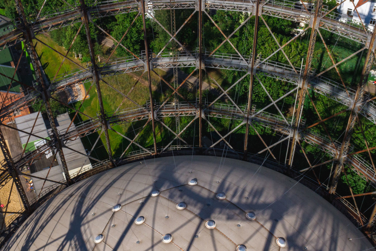 HIGH ANGLE VIEW OF BICYCLE WHEEL IN ABANDONED METAL