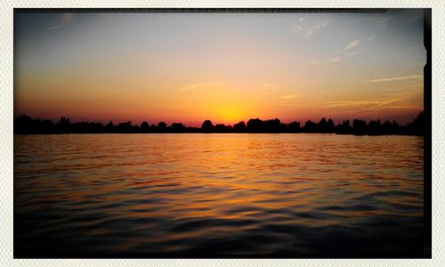 Scenic view of sea at sunset