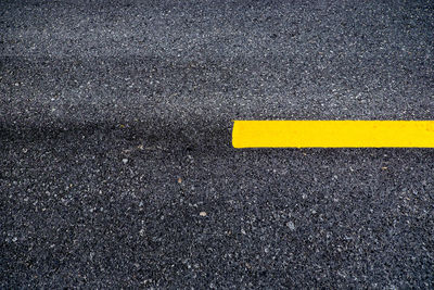 High angle view of arrow sign on road