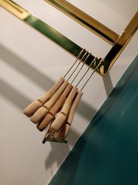 High angle view of guitar on table against wall