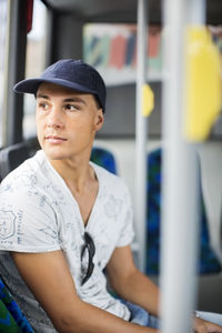 Teenage boy sitting in bus