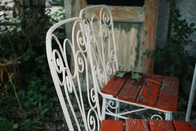 Close-up of text on metal chair