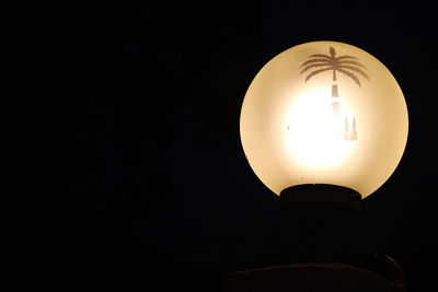 Low angle view of illuminated light bulb