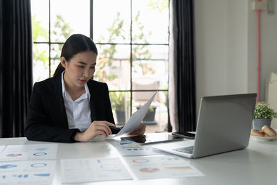 Businesswoman working on table