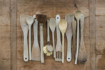 Directly above shot of wooden kitchen utensils on table