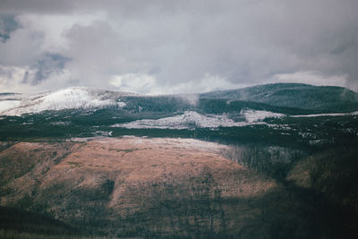 Scenic view of land against sky during winter