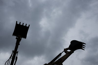 Low angle view of street light against sky