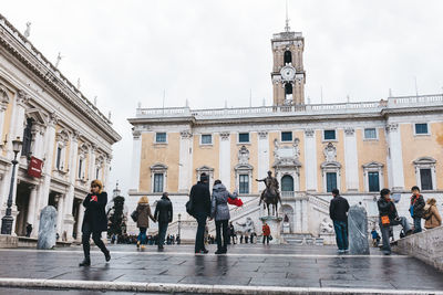Tourists in front of building