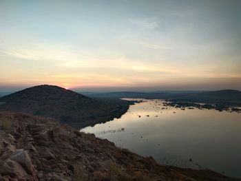 Scenic view of landscape against sky during sunset