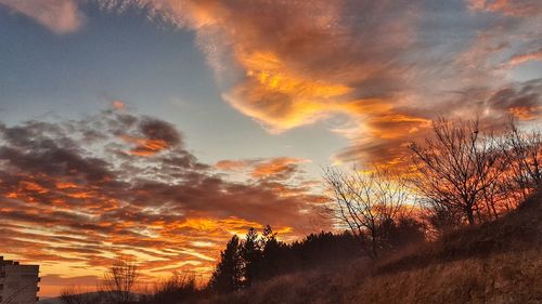 Scenic view of dramatic sky during sunset