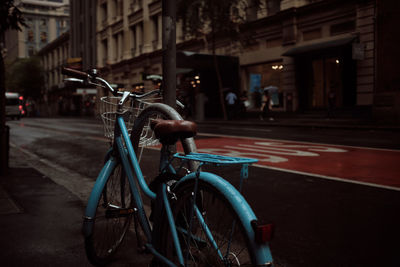 Bicycle parked on street in city