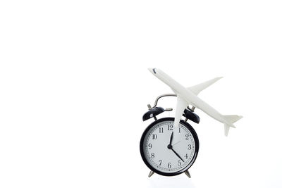 Close-up of clock tower against white background