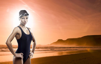 Portrait of man standing on beach during sunset