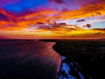 Scenic view of sea against dramatic sky