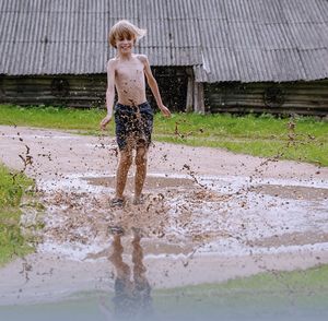 Full length of woman standing in water