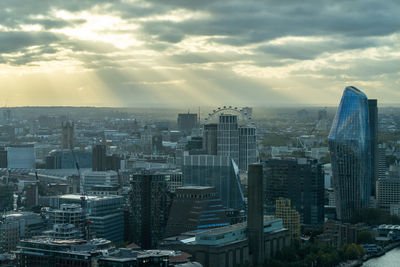 Aerial view of cityscape against sky during sunset