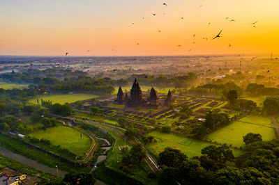 Scenic view of sunset over cityscape