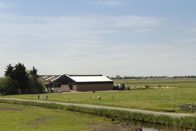 House on field against sky