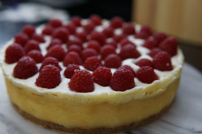 Close-up of cheesecake with raspberries in plate