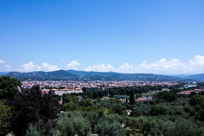 View of town against blue sky