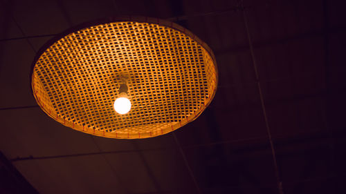 Low angle view of illuminated pendant light