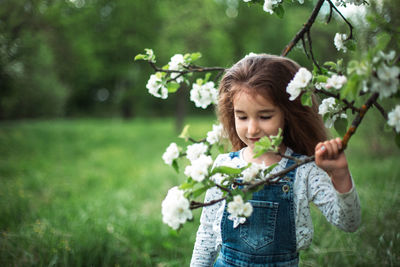 Young woman holding flowers