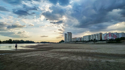 Scenic view of beach against sky during sunset