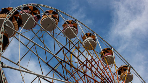 Low angle view of ferris wheel against sky