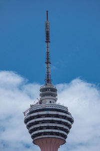 Low angle view of building against cloudy sky