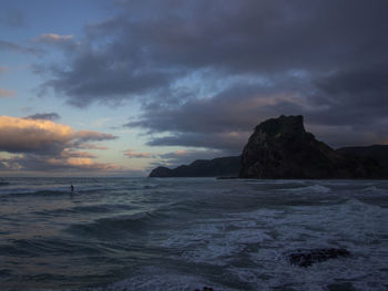 Scenic view of sea against cloudy sky