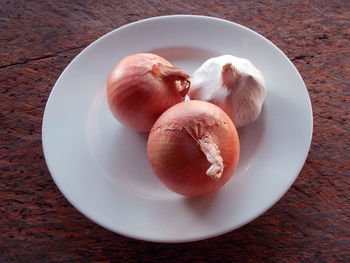High angle view of eggs in plate on table