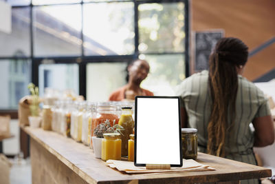 Businesswoman using laptop at table