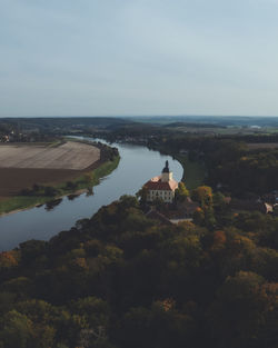 High angle view of buildings by sea against sky