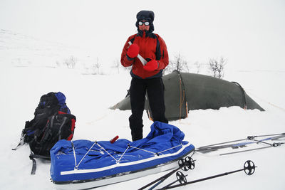 Woman having camping at winter