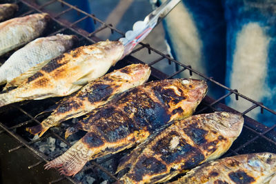 Close-up of meat on barbecue grill