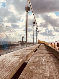 Surface level of pier against sky