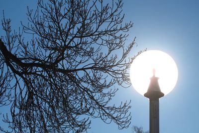 Low angle view of street light against sky