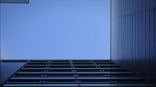 Low angle view of building against clear blue sky