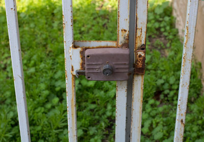 Close-up of rusty metal gate