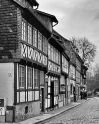 Houses by street in town against sky - fachwerkhäuser - black and white photography